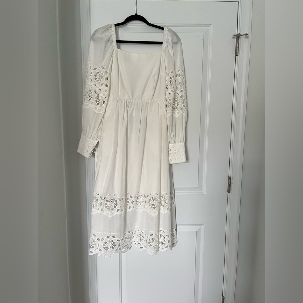 Lace white dress with cut out detail. Purchased at Beau & Ro. Never worn. NWT